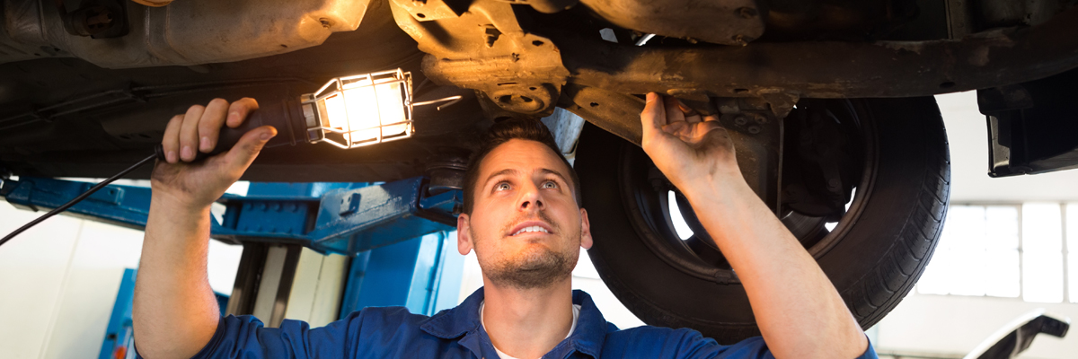 Mechanic doing an MOT test on a vehicle - MOT Kirkcudbright